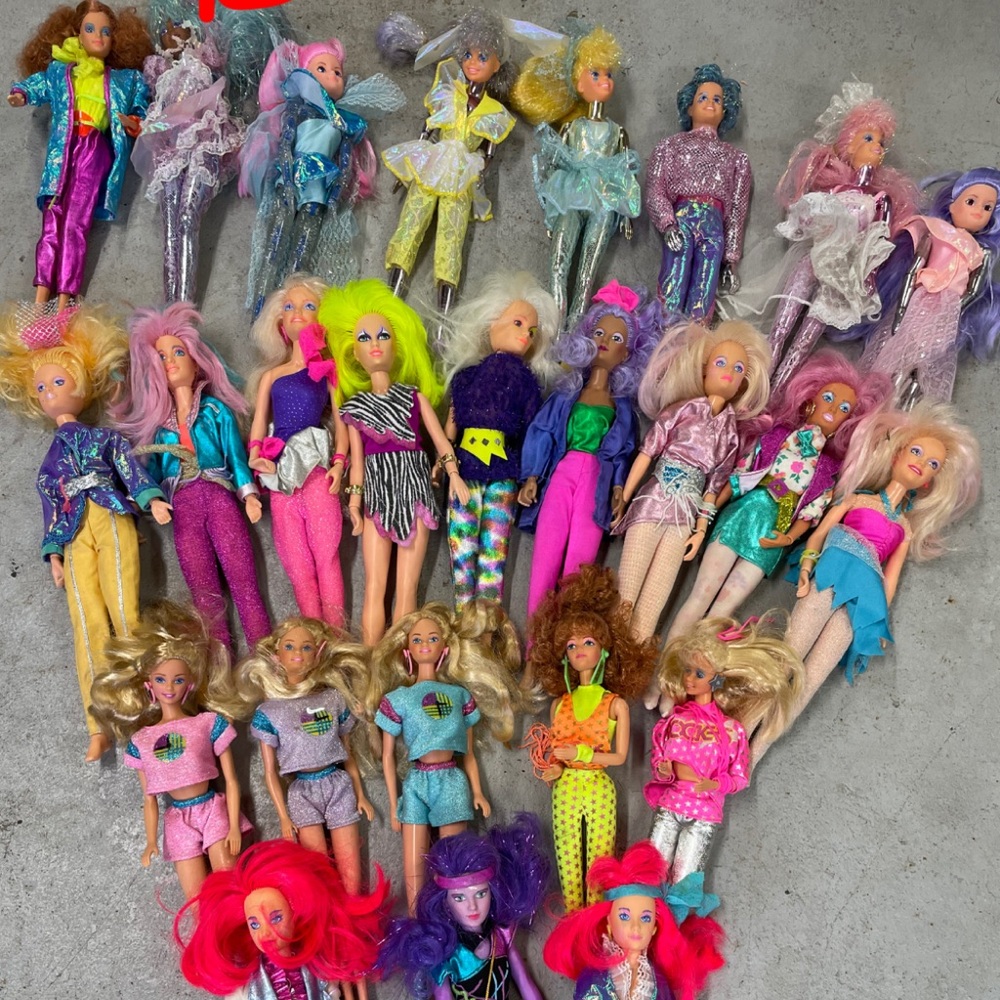 3 boxes of random barbies.